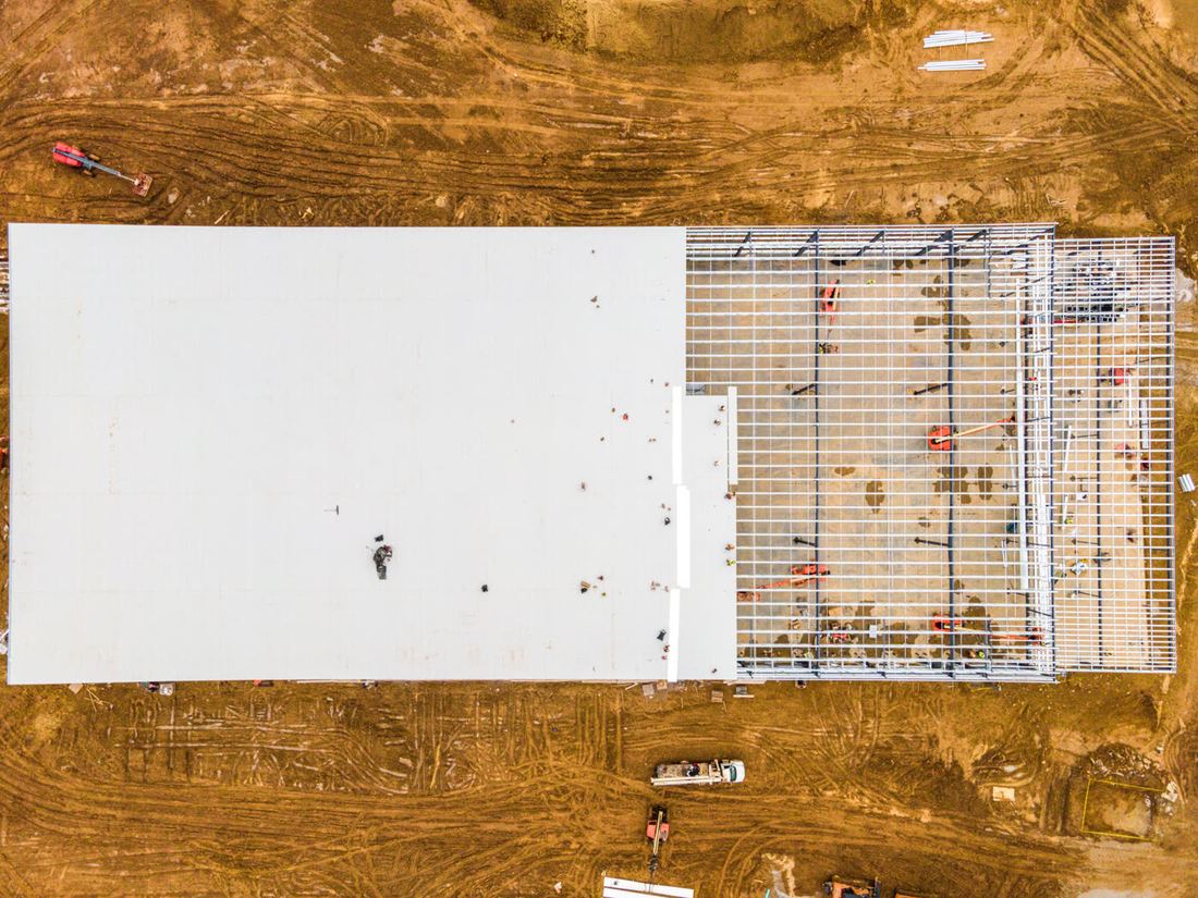Samma byggprojekt vid färdigt resultat, fotograferat från luften